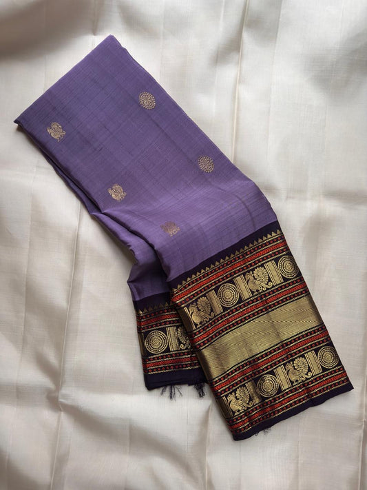 Lavender handwoven pure silk Kancheepuram saree with deep navy border
