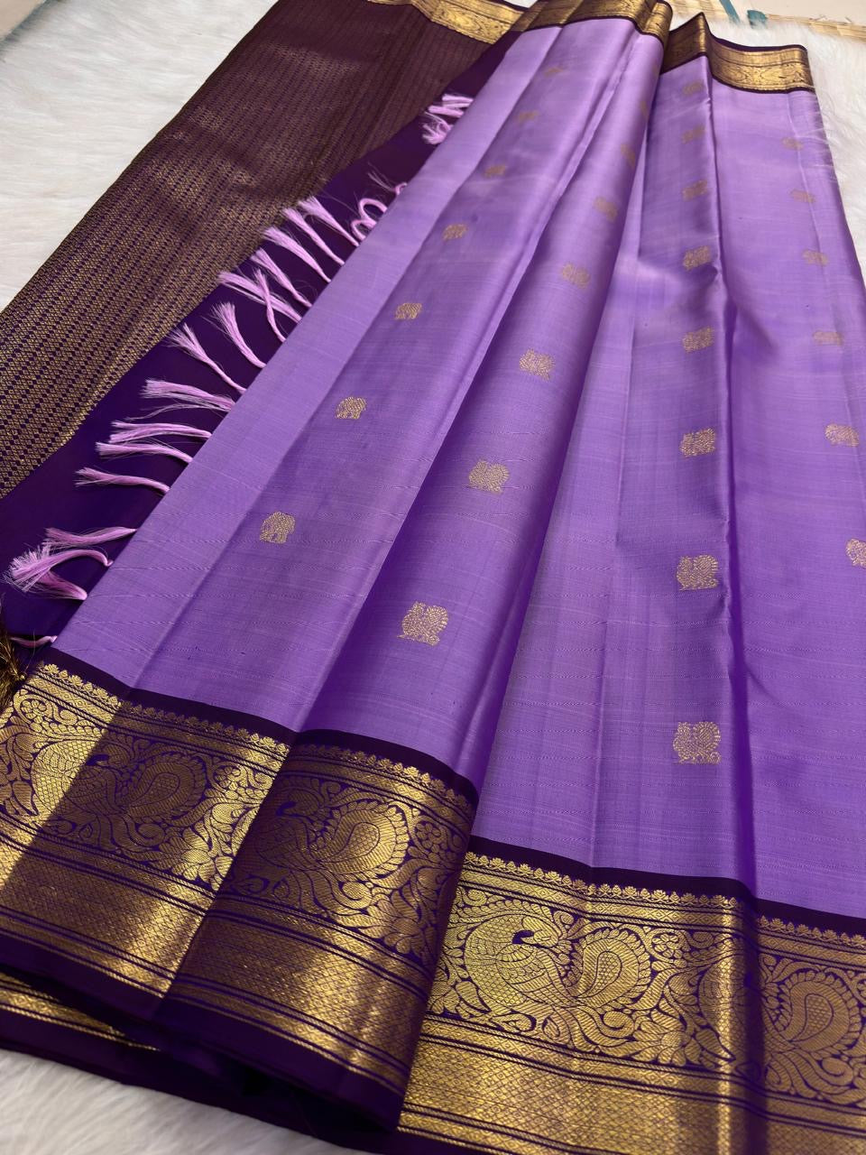 Lavender purple Kanjeevaram silk saree — gold zari butta body close-up