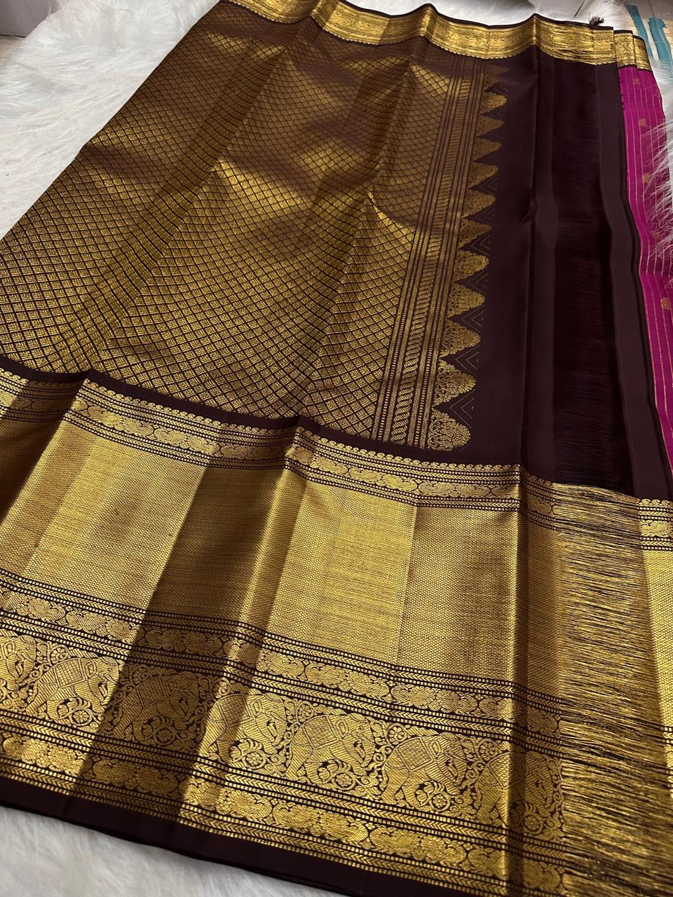 Shimmering narrow zari filaments woven in parallel lines on pure Kanchipuram silk