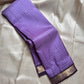 Lavender checked Kanchipuram silk saree drape showing fine kattam lines and zari woven border