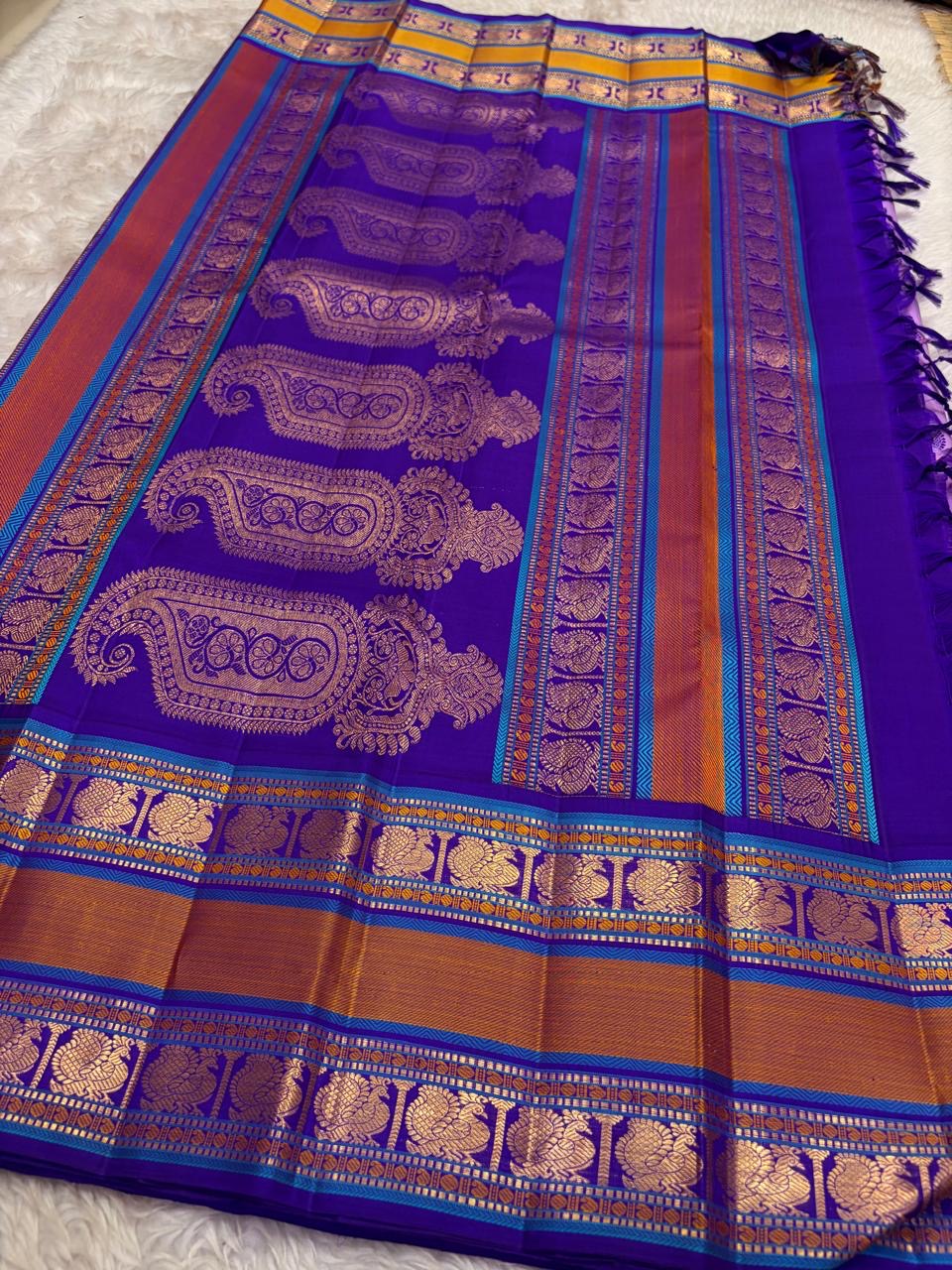 Lavender Kanjivaram silk saree with royal purple Varisaipet border, full length view