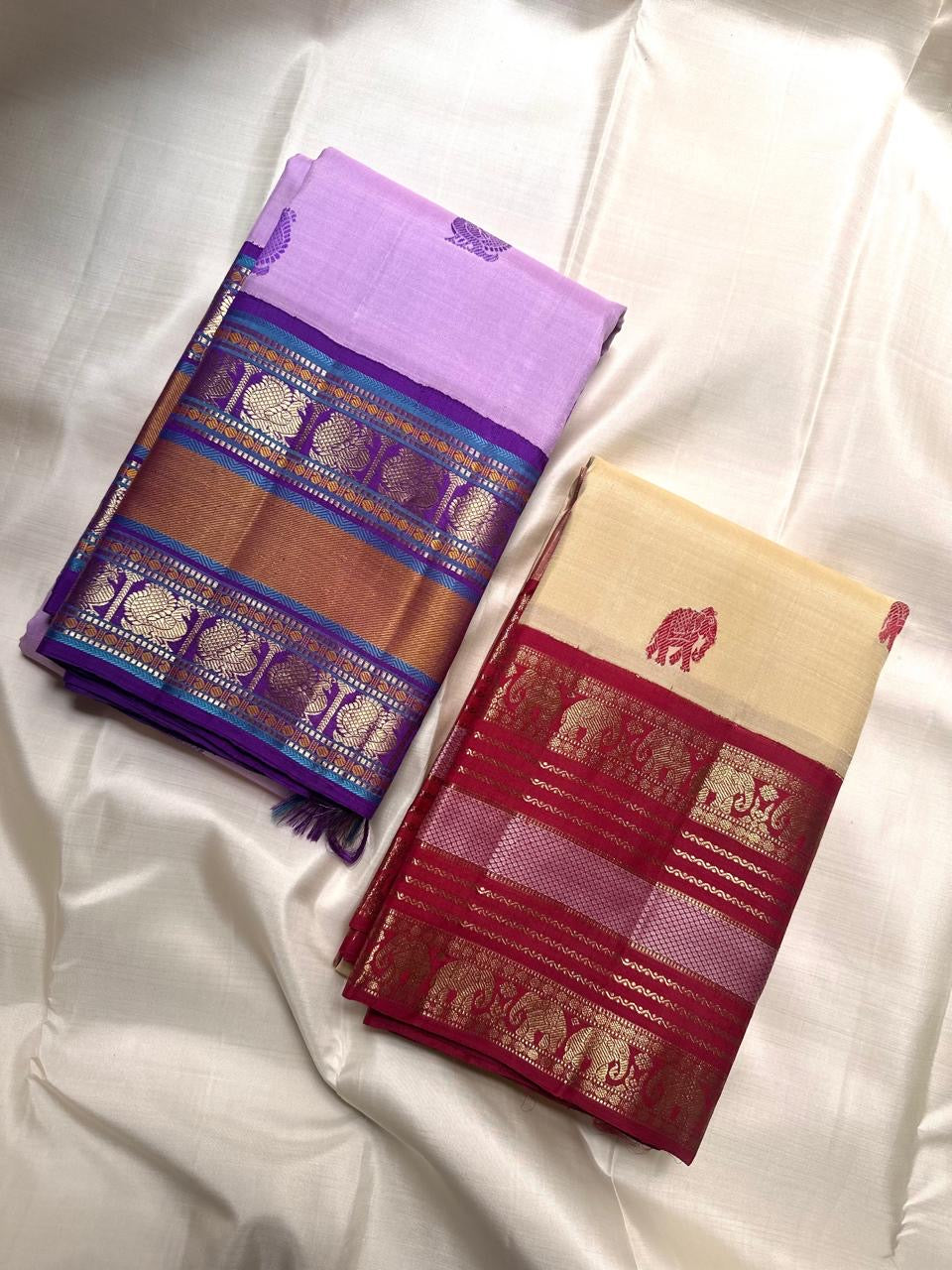 Cream Kanchipuram silk saree pallu with maroon red and gold elephant registers, pallu view