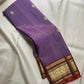 Lavender Kathiripoo Pure Silk Kanchipuram Butta saree with gold buttas and warm Rust-Arakku zari border.