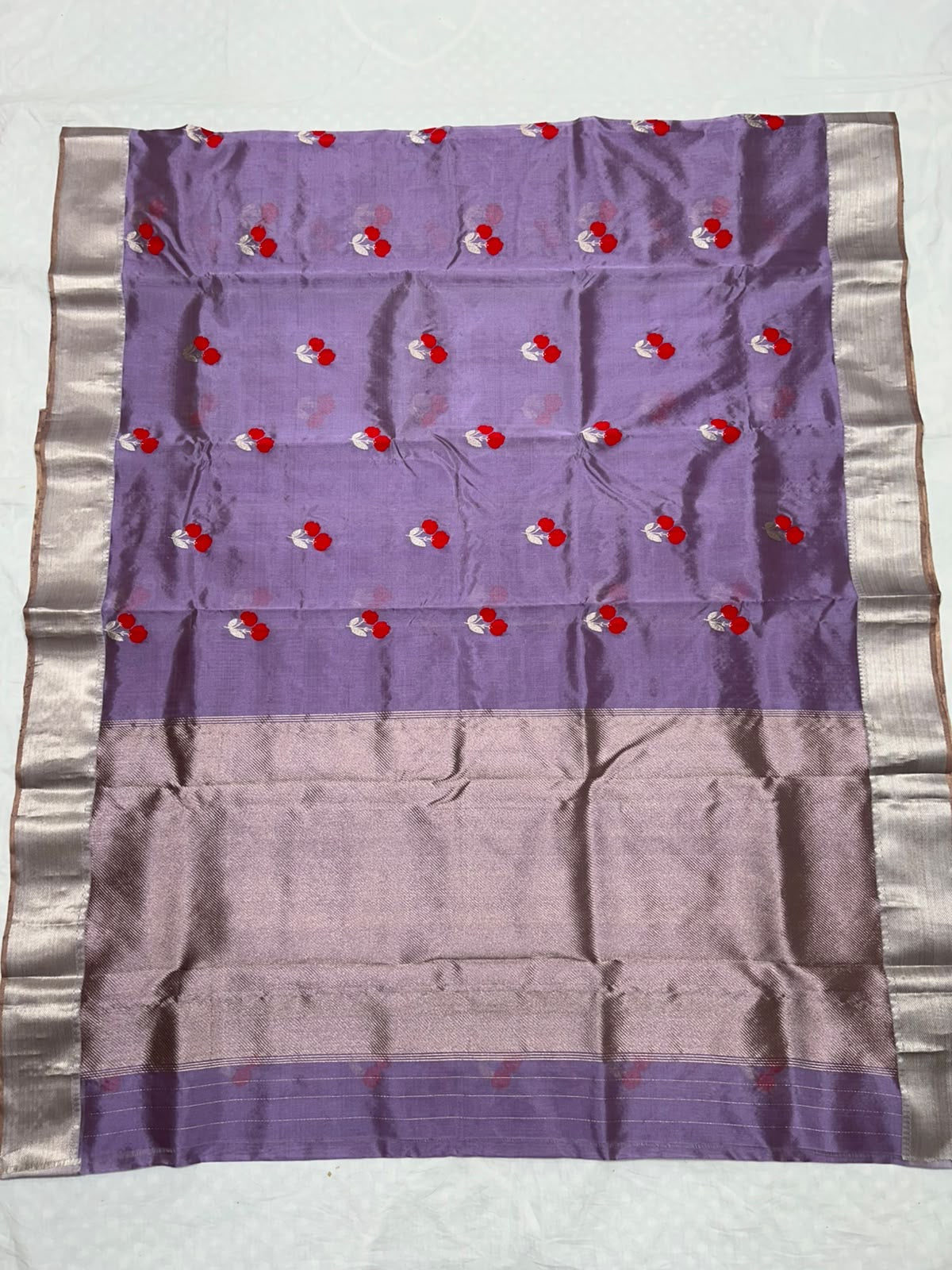 Lavender purple Pattu Silk Chanderi saree with red floral motifs and silver zari borders
