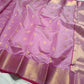 Lavender Pink handloom Chanderi silk saree opened to show gold buttas, ornamental border and luminous woven pallu
