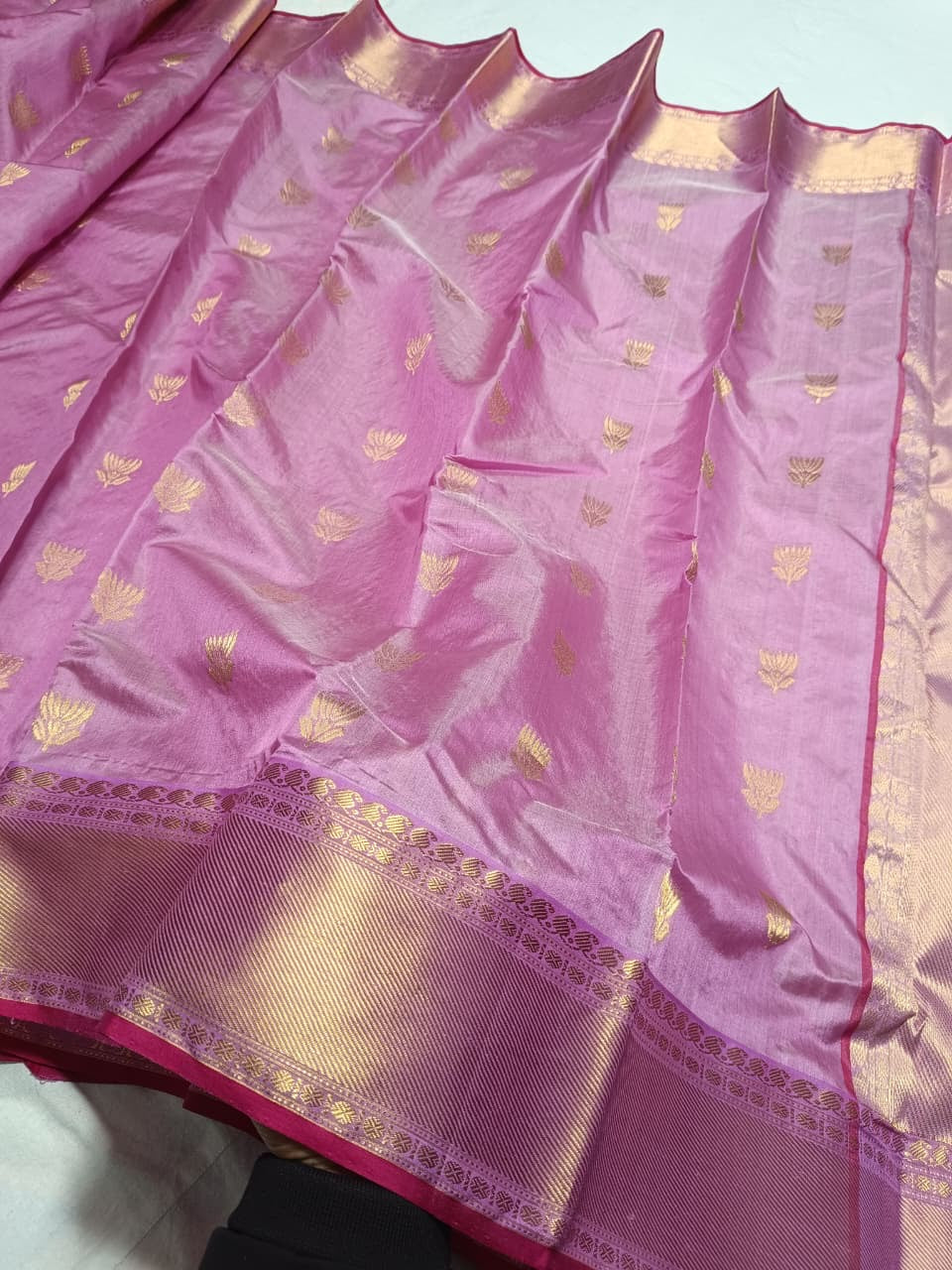 Lavender Pink Pattu Silk Chanderi saree with petite gold floral buttas, broad woven gold border and raspberry edging