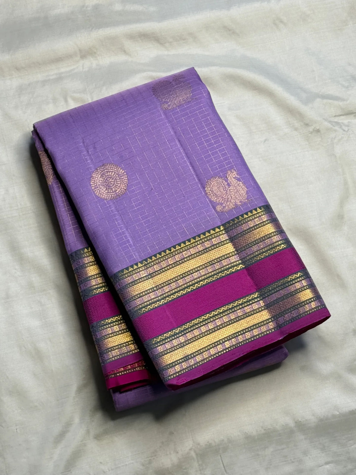Lavender Kanchipuram silk saree with fine intersecting Zari Kattam checks and woven zari buttas.