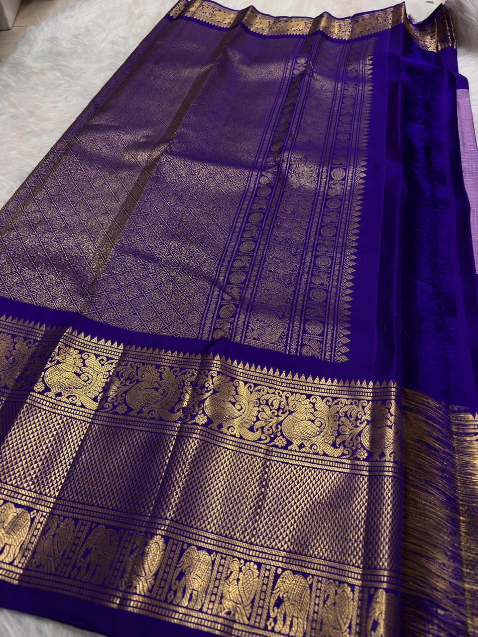 Close view of antique-gold zari butta on Lavender Silver Kanjivaram silk.