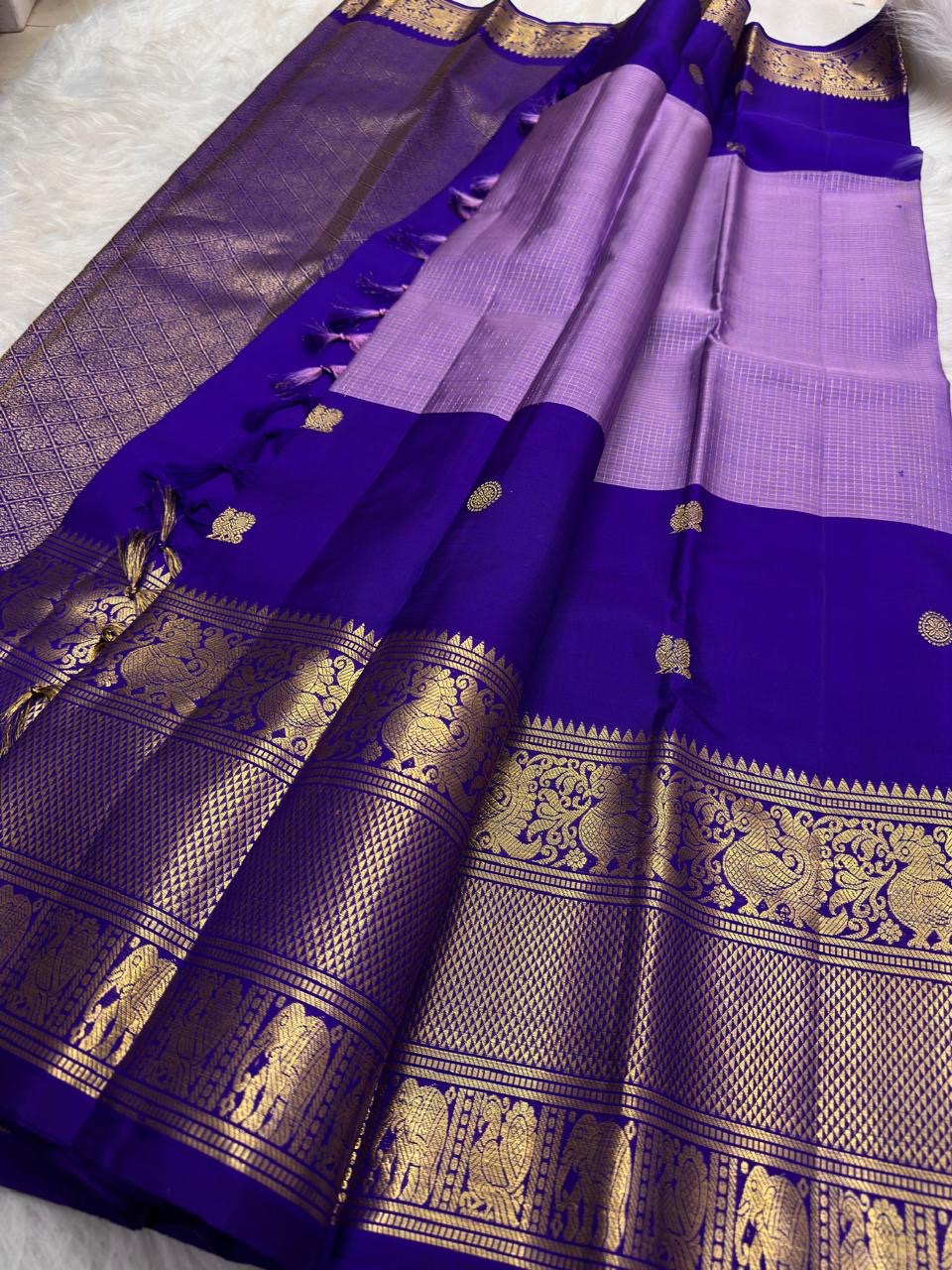 Lavender Silver handwoven pure silk Kanjivaram Butta saree with Royal Purple contrast.