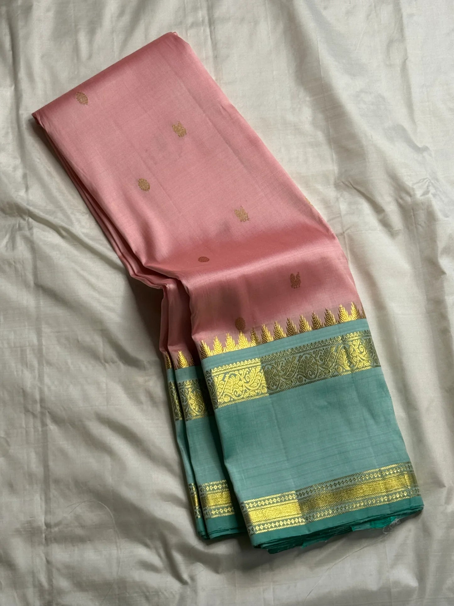 pink silk kanchipuram saree body with gold zari buttas and contrast border