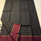 Full spread view of black checked Pure Kanchipuram Silk Saree with maroon border and slim zari edge along the width