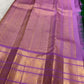 Leaf-green accent detail on an orchid-lilac handwoven pure silk Kanchipuram Varisaipet saree