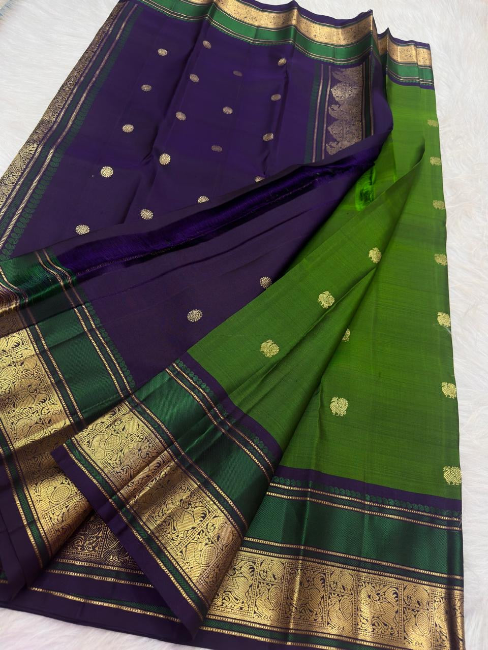 Ornate zari pallu detail on leaf green pure silk Kanjivaram saree