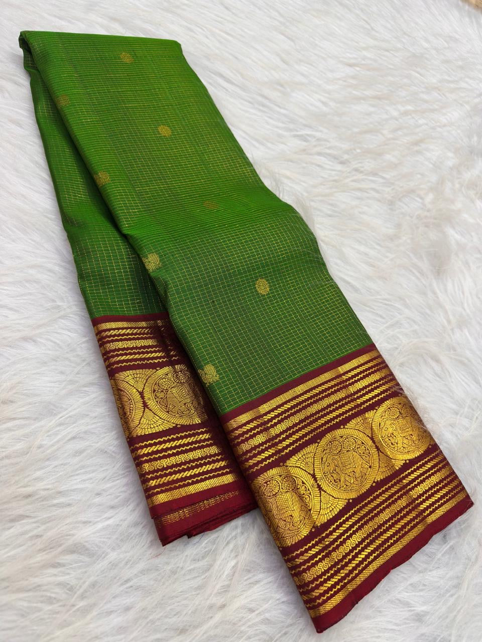 Leaf Green Kanchi Pattu Zari Kattam saree — maroon elephant medallion border close-up