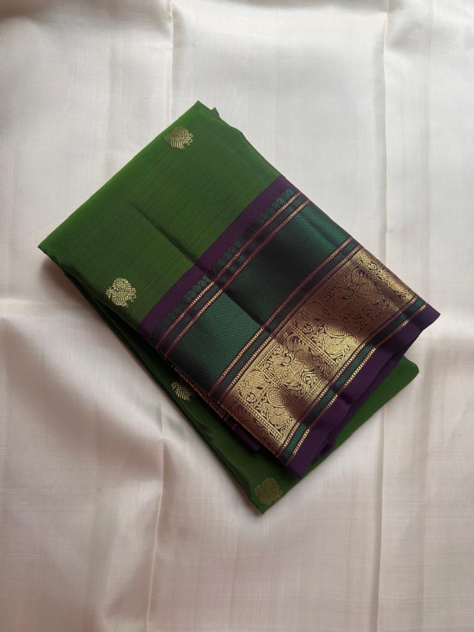 Leaf green pure silk Kanjivaram saree with gold zari Butta motifs, full drape view