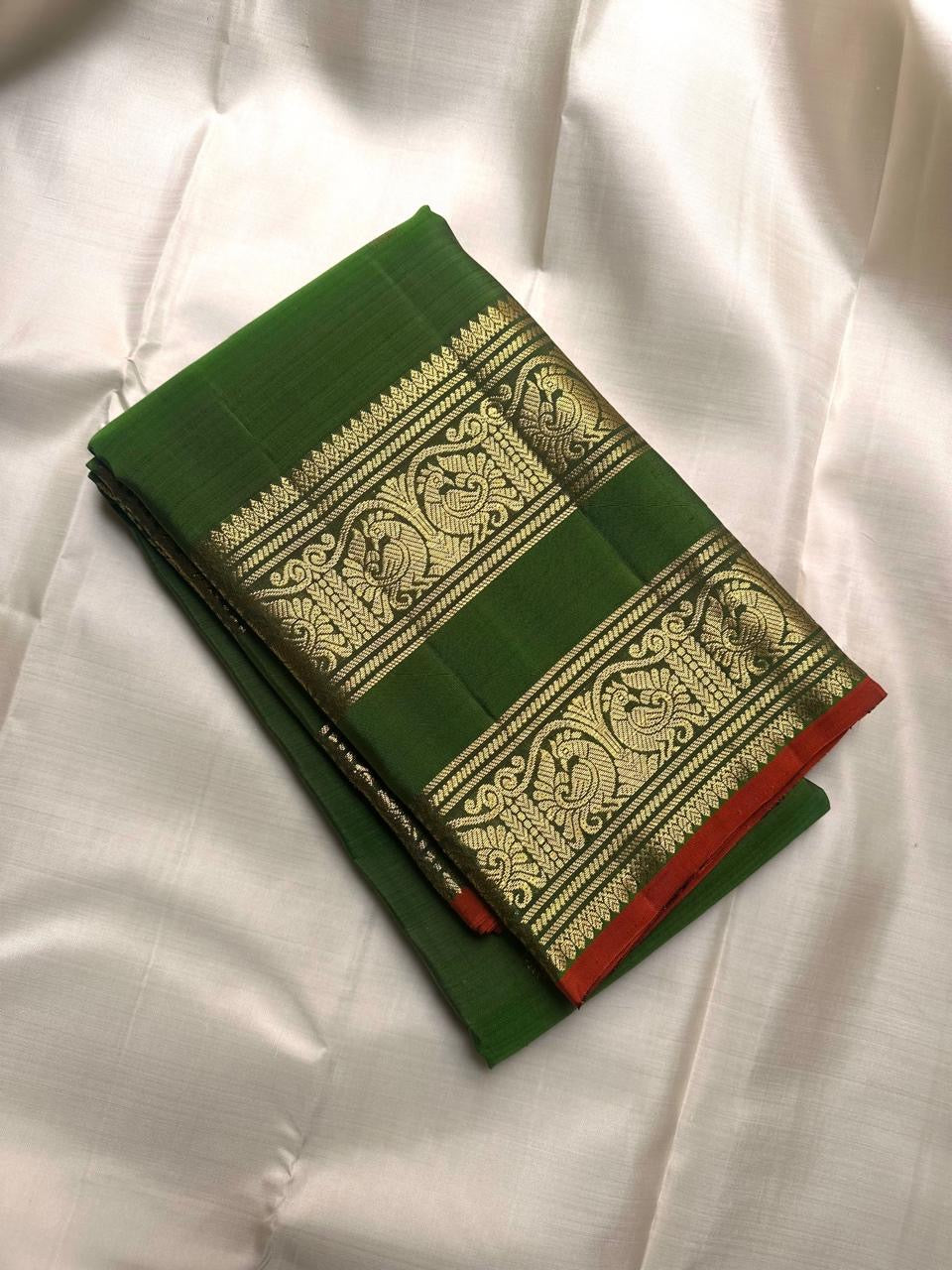 Leaf green pure silk Kanjipuram Rettapet saree with peacock archway zari border