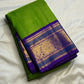 Handwoven Korvai saree with Royal Purple contrast border and antique-gold paisley forms.