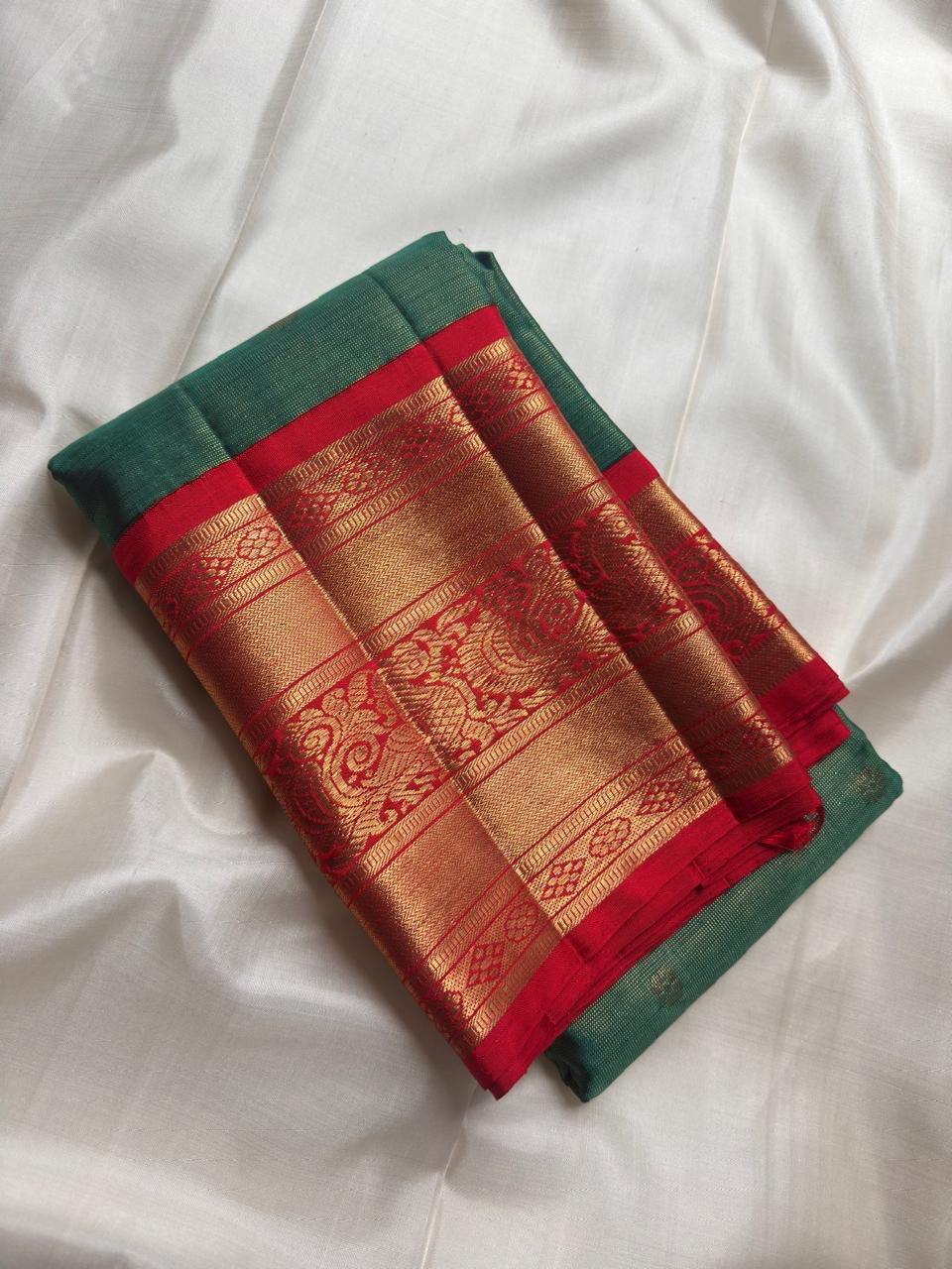 Leaf green pure silk tissue body with small gold buttas.