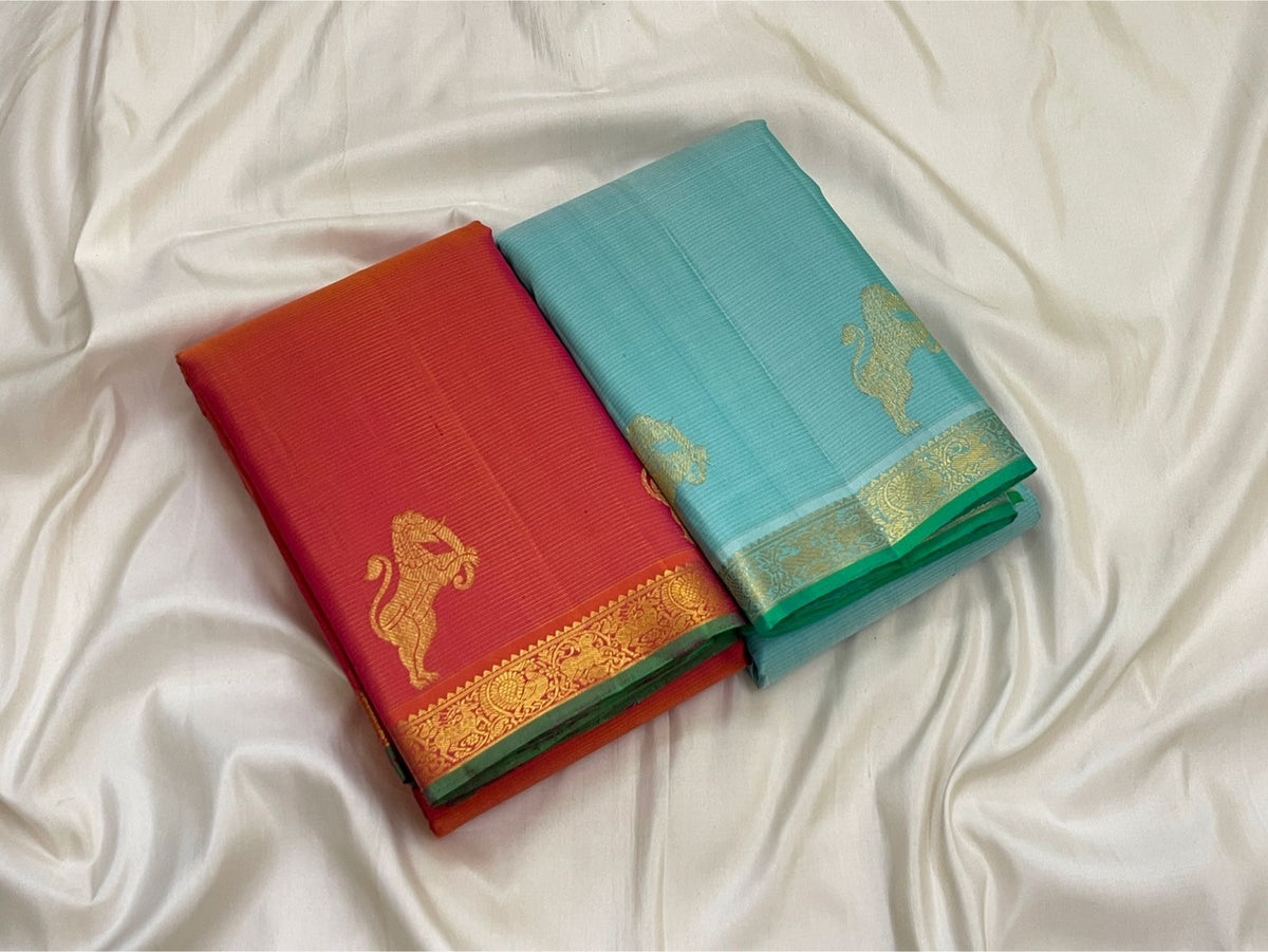 Fine directional zari lines creating shimmer across Aqua Ice Blue pure Kanchipuram silk.