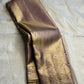 Light lavender-gold Pure Silk Kancheepuram Butta saree with a dense diagonal body and Banarasi-inspired brocade border.