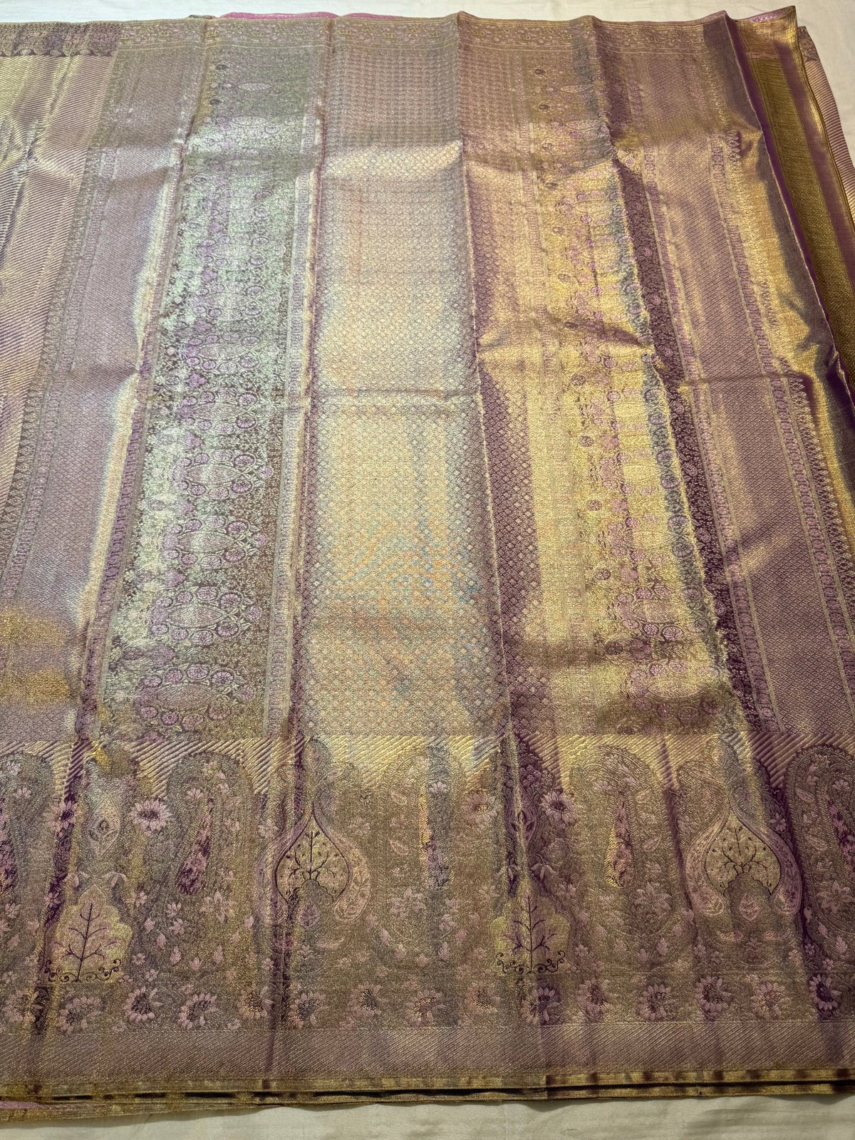 Handwoven Pure Silk Kanjivaram showing the diagonal lavender-gold body transitioning into a dense brocade border.