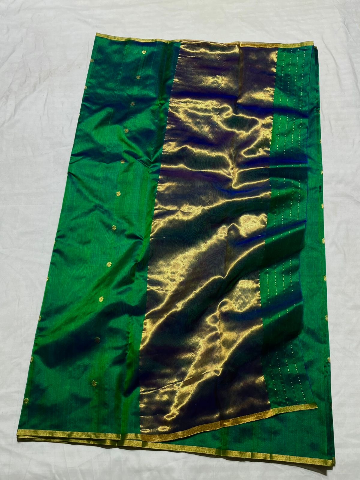 Handwoven pure silk Chanderi saree in jewel-toned green with peacock blue undertones