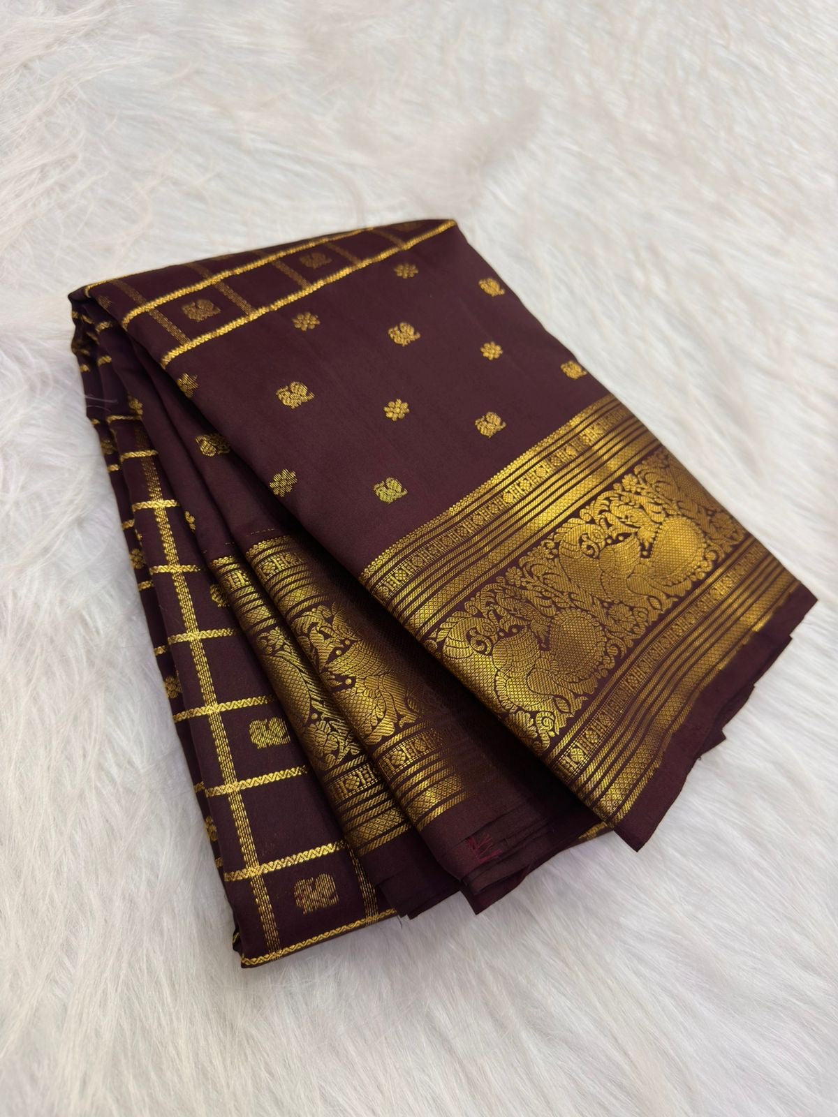 Traditional Lightweight Kanchi Pattu saree with plum-brown body and antique-gold Mayil zari Pettu