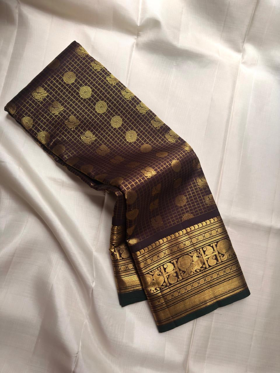 Cinnamon brown handwoven pure silk Kanjeevaram saree with peacock motif border — full saree overview — Idam Living