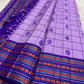 Pallu view of the lilac saree with royal-purple contrast.