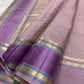 Turquoise silk-thread accents on lavender border, dusty-lilac Kanjivaram saree