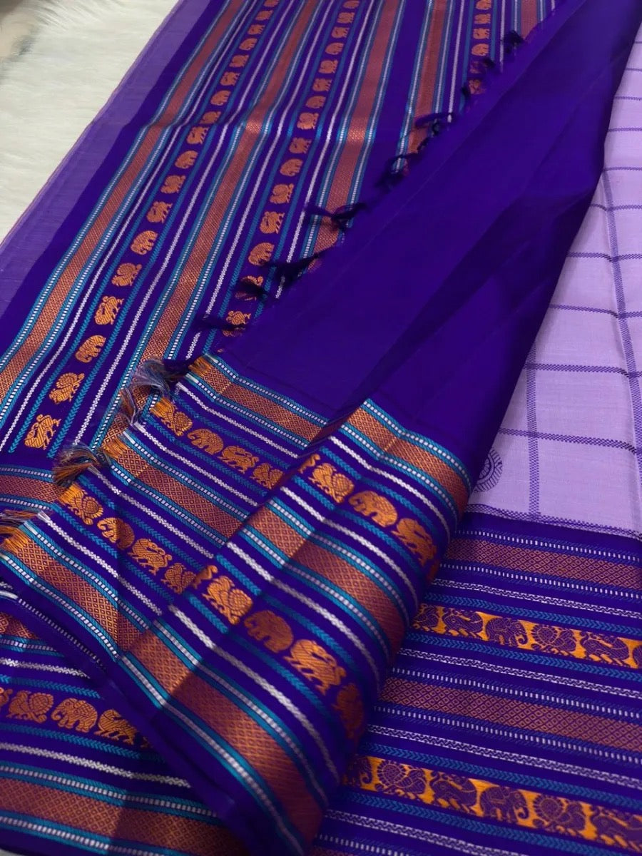 Checked lilac body with roundel motifs.