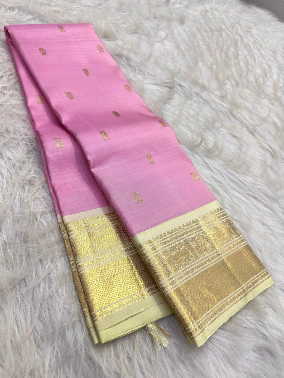 Kamalam butta detail on pastel pink Pure Silk saree