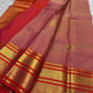 Close view of the soft peach and Oodha purple body with needle-fine Vairaoosi stripes and zari threads.