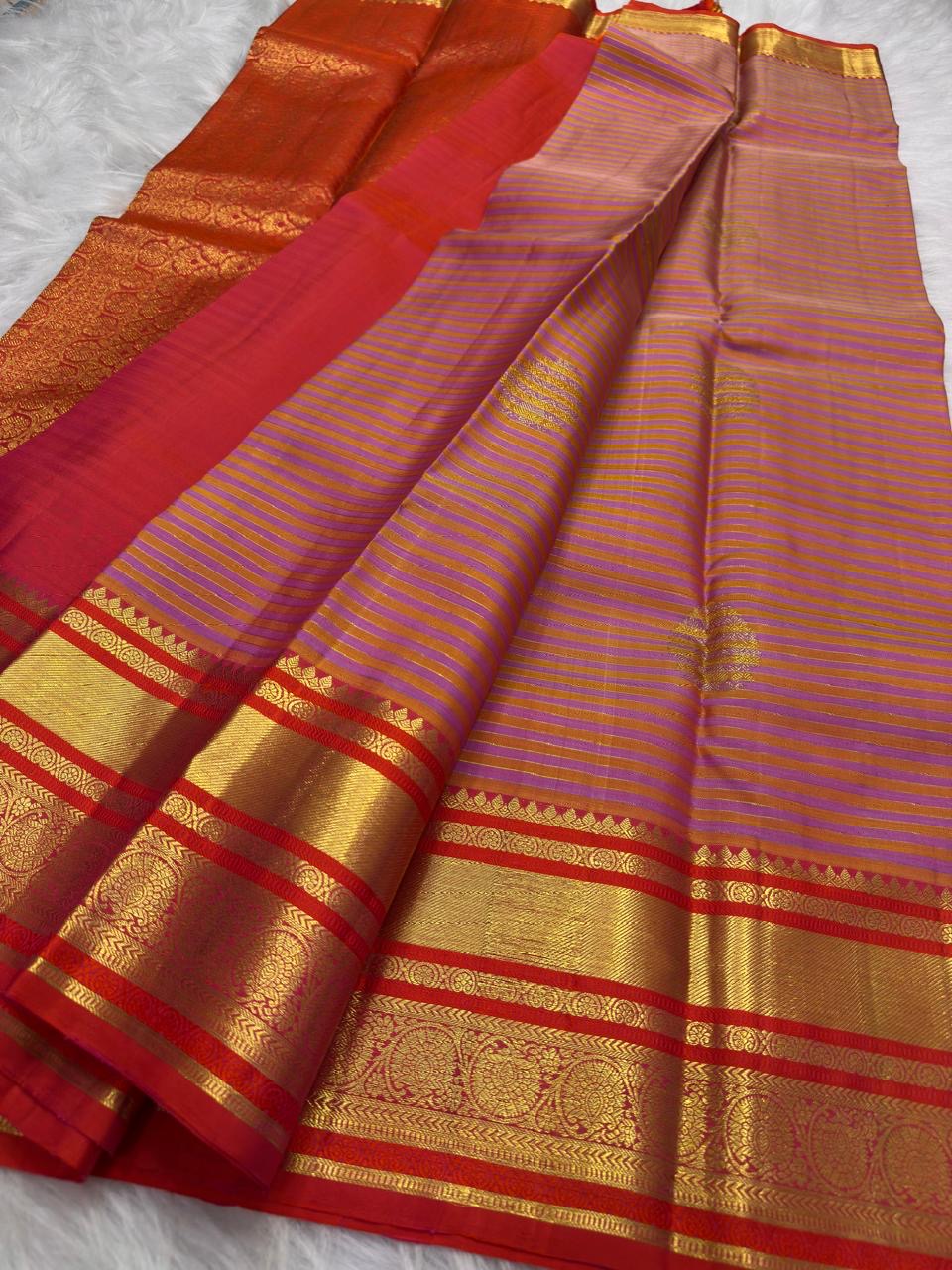 Close view of the soft peach and Oodha purple body with needle-fine Vairaoosi stripes and zari threads.