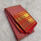 Peach and purple Vairaoosi pure silk Kanchipuram saree with fine zari stripes, decorative buttas and contrast border.
