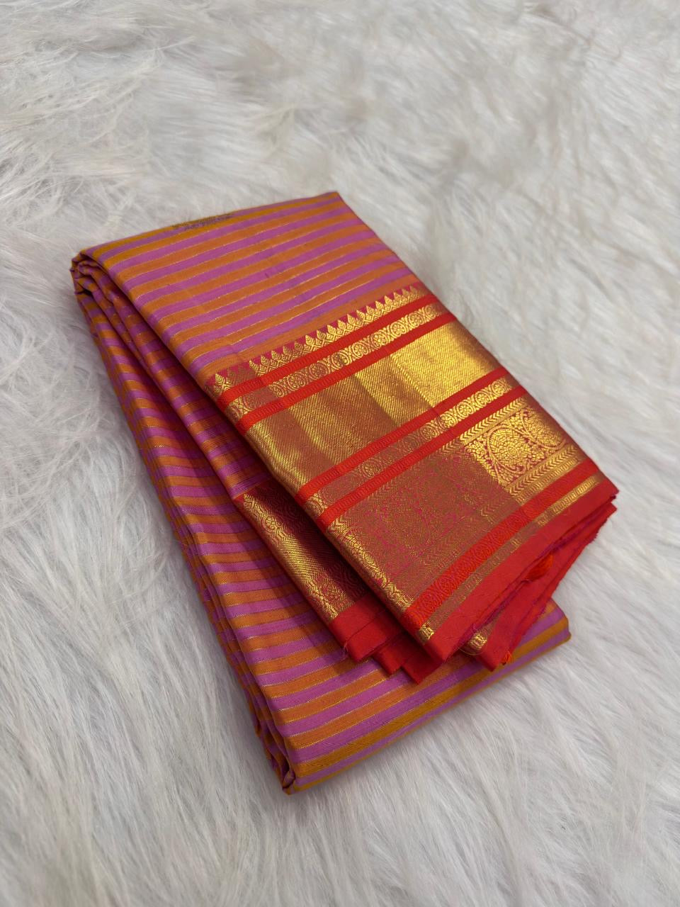 Peach and purple Vairaoosi pure silk Kanchipuram saree with fine zari stripes, decorative buttas and contrast border.