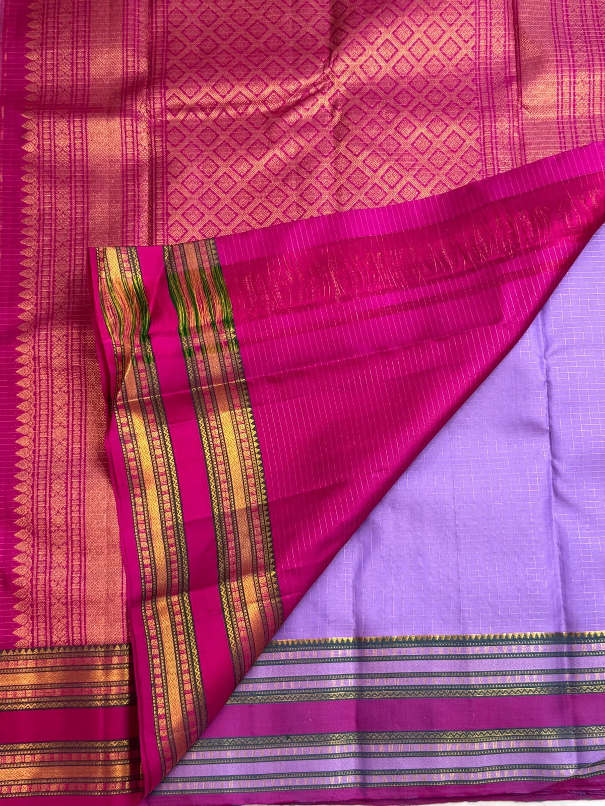 Clear lilac-lavender purple with fine gold checks pure silk Kanchipuram saree, rani pink varisaipet zari border; traditional Zari Kattam weave.