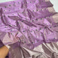 Close-up of a floral butta motif on lilac Tissue Silk Chanderi saree