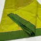 Detail of petite gold woven buttas with tiny turquoise-blue accents on a Lime Green Chanderi silk saree