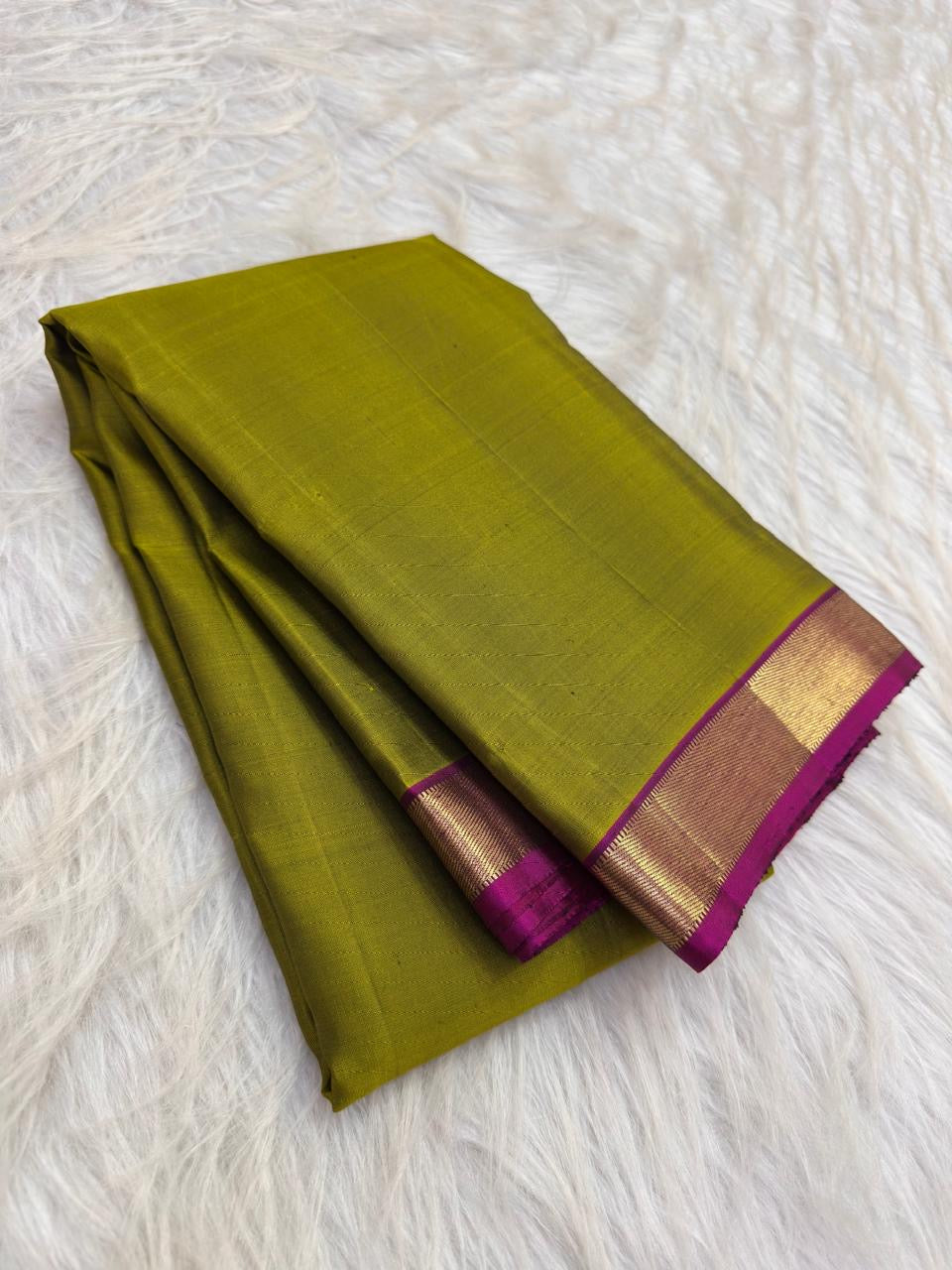 Lime green Kanjeevaram silk saree with gold zari border, border detail