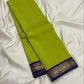 Pure silk Kanchi Kattam saree with a lime-yellow checked body and purple zari edge