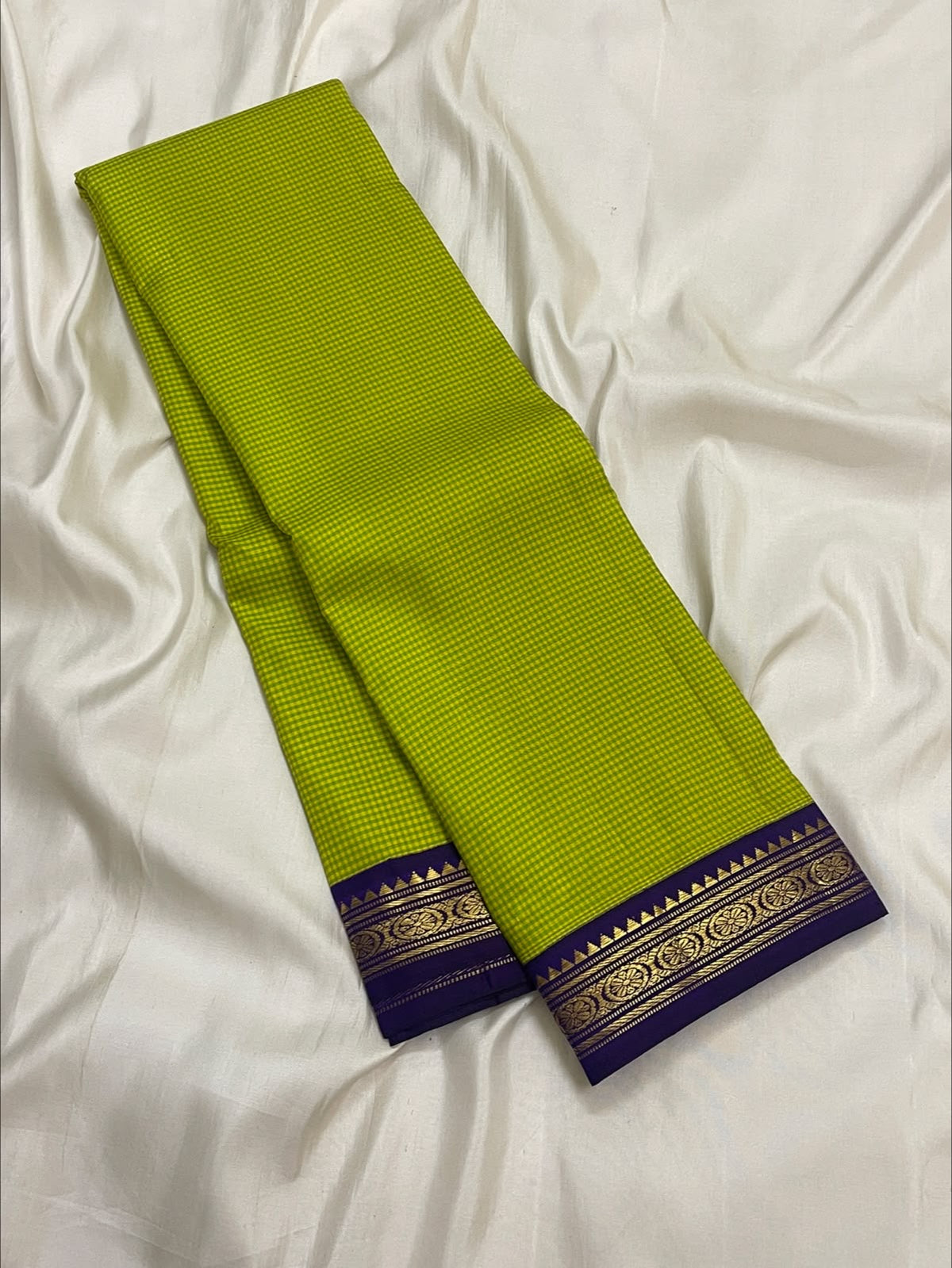 Pure silk Kanchi Kattam saree with a lime-yellow checked body and purple zari edge
