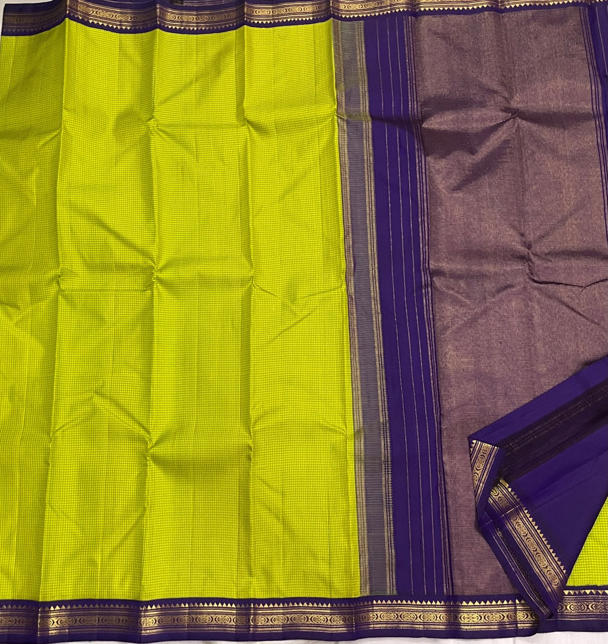 Close view of the exceptionally fine yellow-green checked grid woven across the silk body