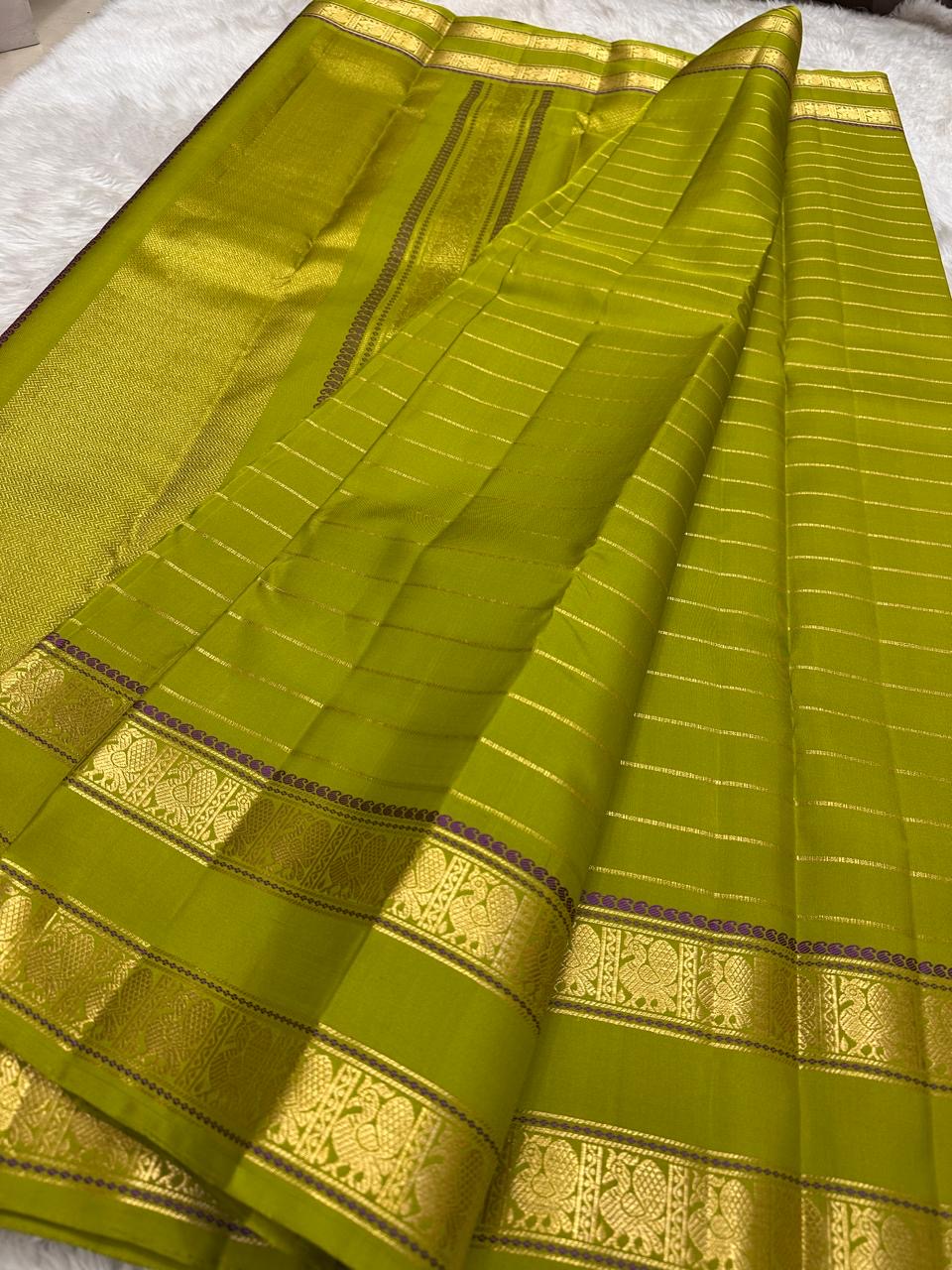 Purple silk thread accent stripes on rettapet border of lime green Kanchipuram saree — Idam Living