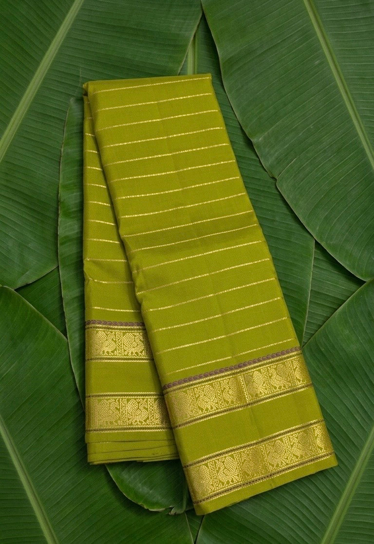 Lime green handwoven Kancheepuram pure silk saree with seepu reku body and rettapet vanasringaram border — Idam Living