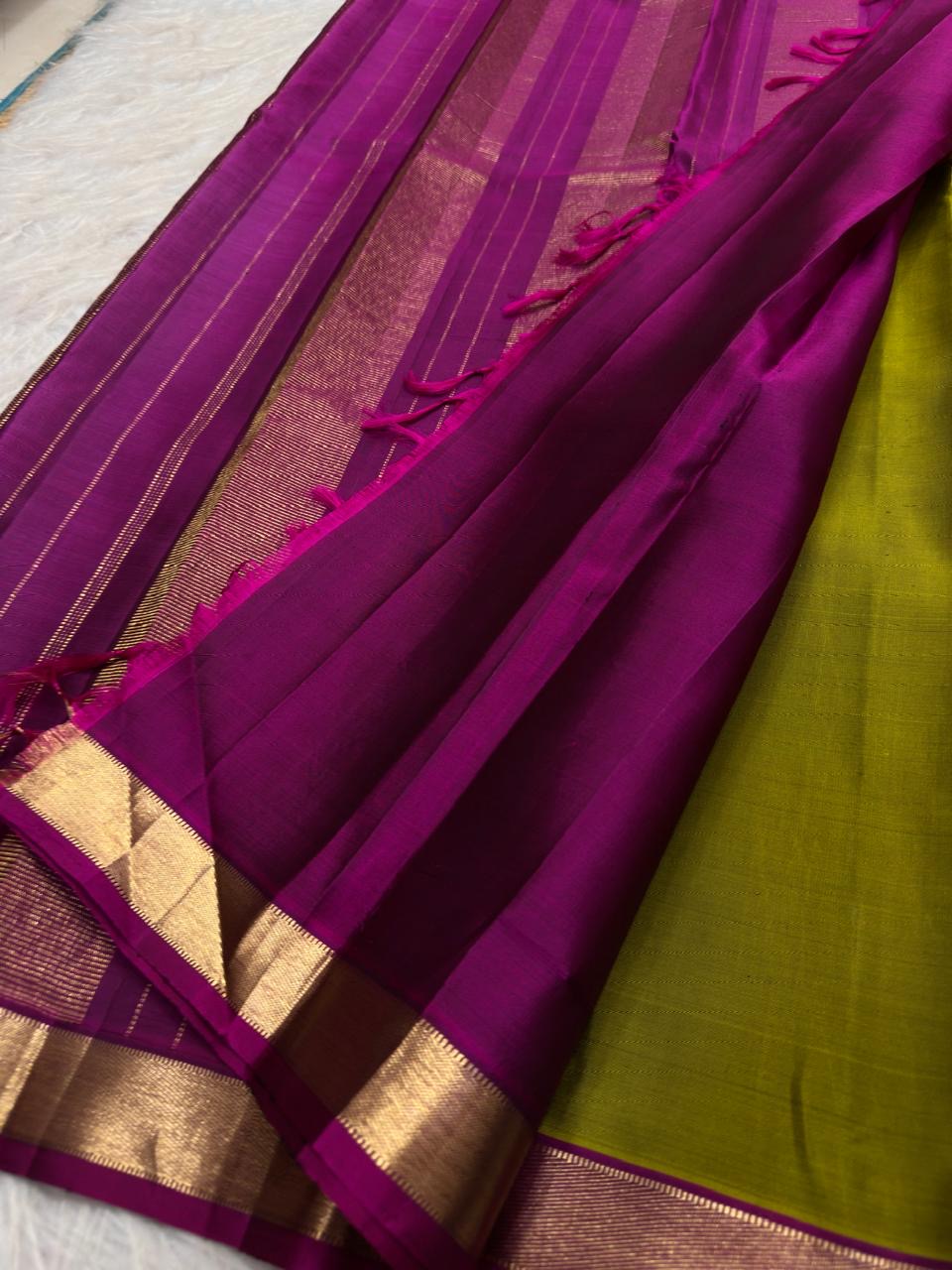 Lime green lightweight Kanjeevaram silk saree with coral pink pallu