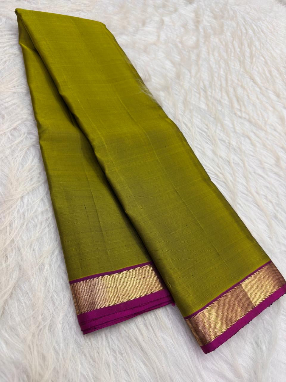 Lime green lightweight Kanjeevaram silk saree with coral pink pallu and gold border, full view