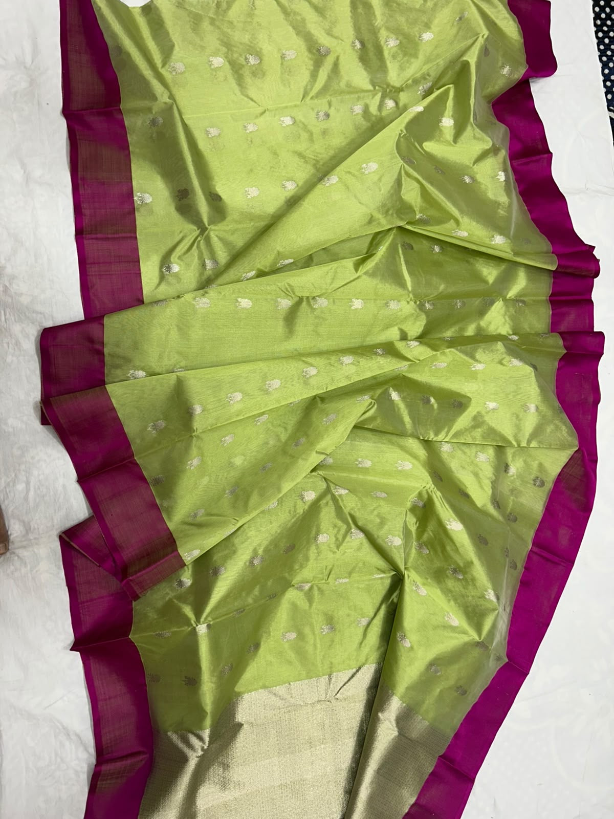 Lime green Pattu Silk Chanderi saree with magenta borders and floral buttas, shown draped.