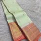 Peach contrast border showing fine geometric zari bands, ornamental registers and softly antique gold detailing.