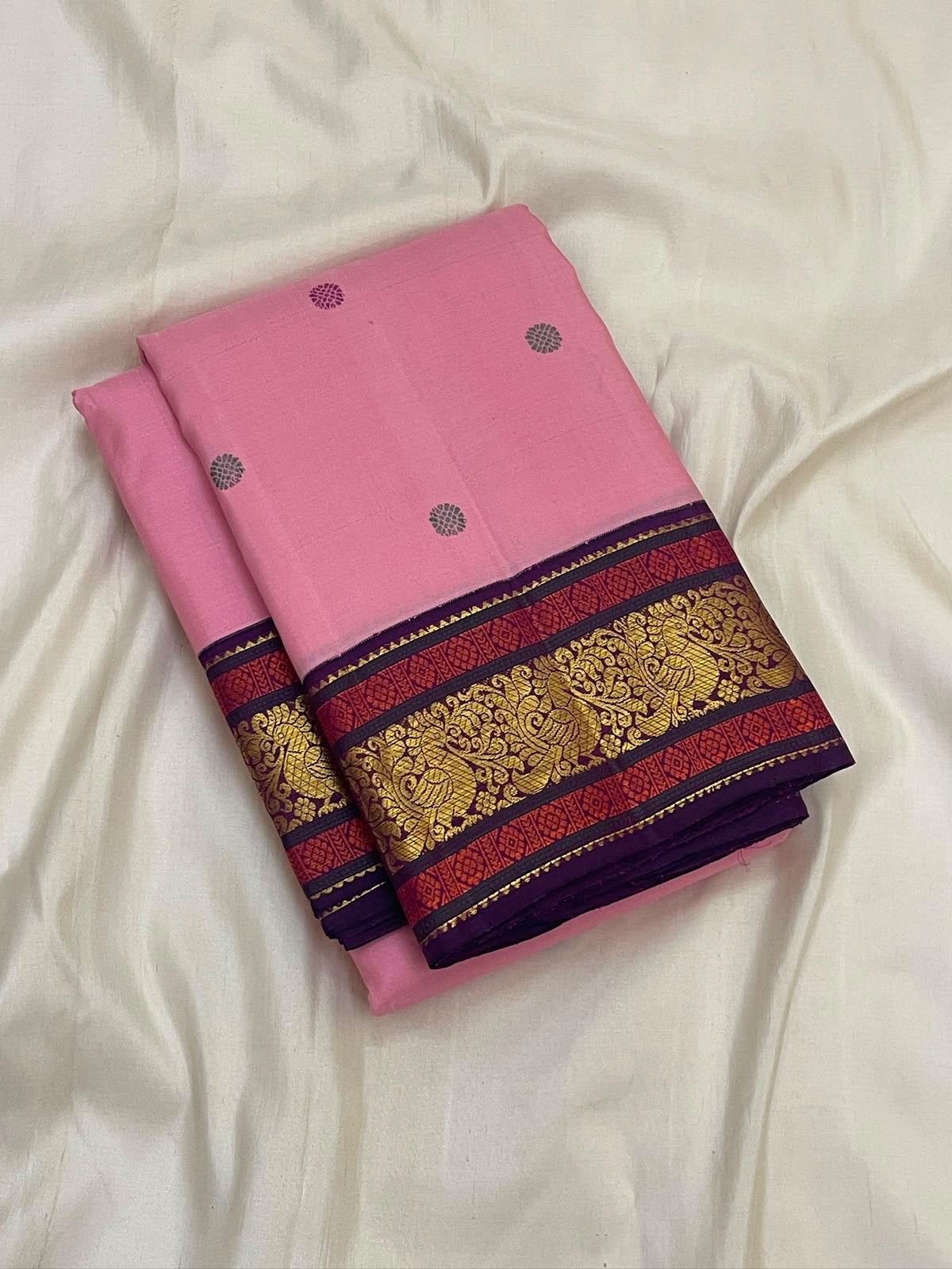 Handwoven lotus pink Kanjivaram saree with silk thread buttas